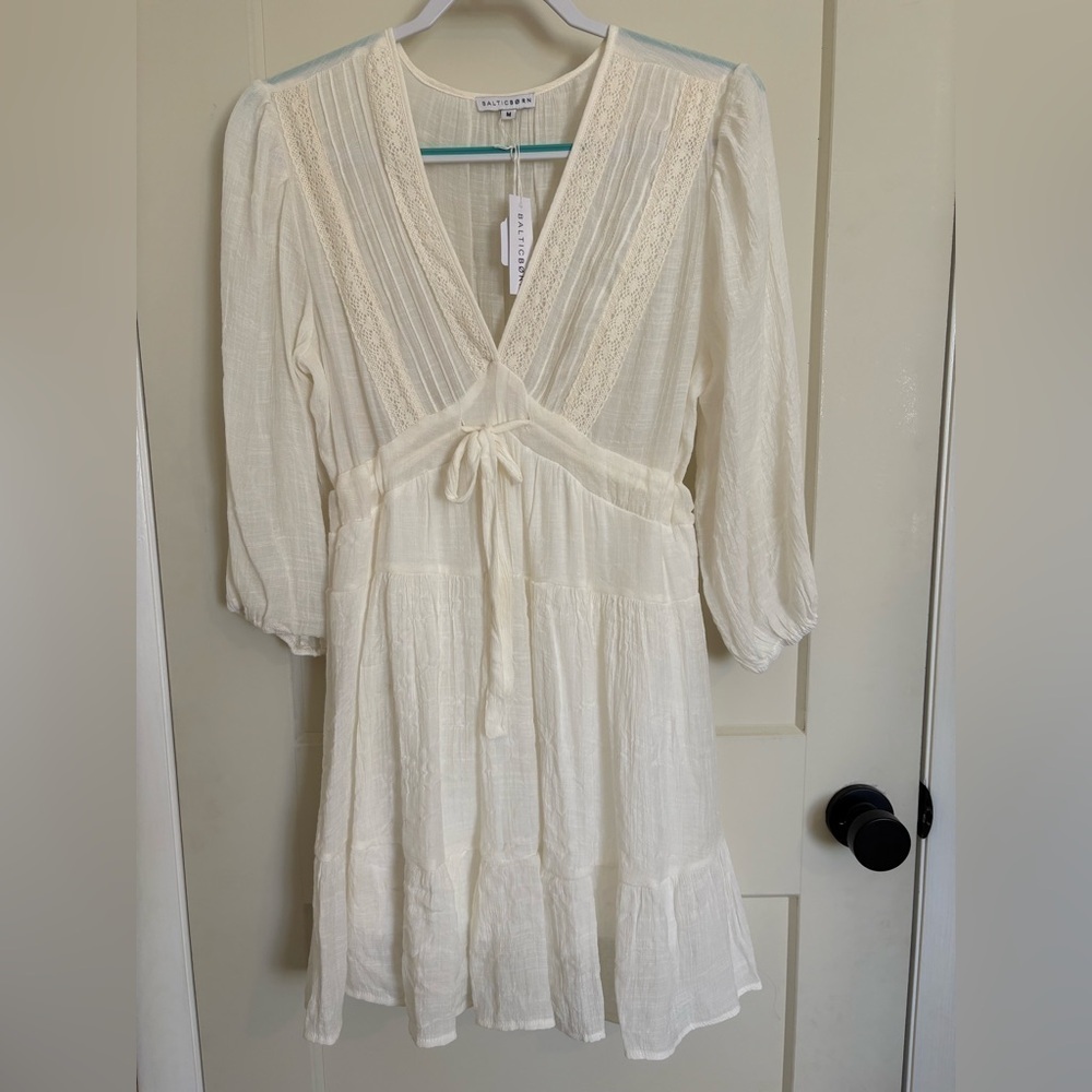 Baltic Born Cream Sundress with Plunge Neckline Long Sleeve and Ruffled Skirt